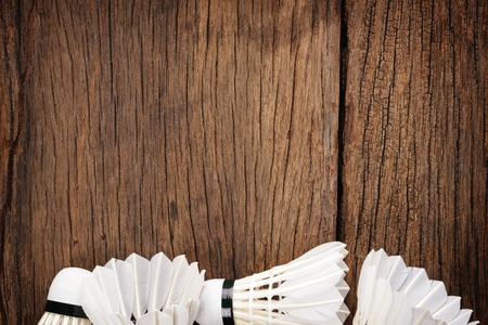 wooden background with shuttlecocksの写真素材