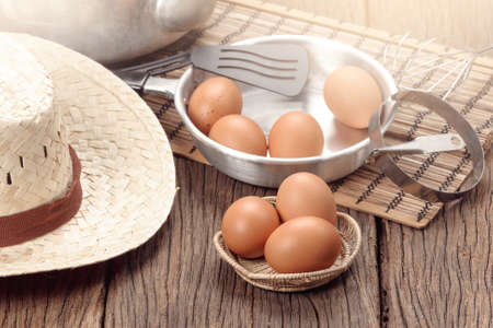 closeup group of fresh eggs on wooden plank