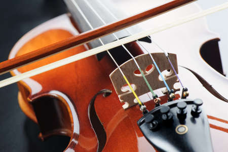 closeup new classical violin on black backgroundの写真素材