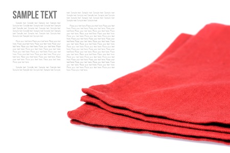 isolated folded red napkin over white backgroundの写真素材