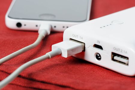 white power bank for charging mobile devicesの写真素材