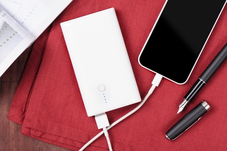 white power bank charging smart phone