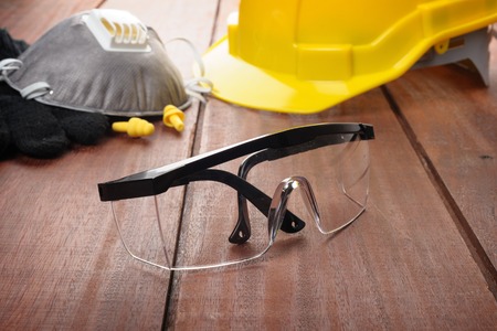 safety glasses on wooden plank safety glasses on wooden plank