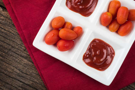 closeup details of ketchup and tomatoesの写真素材