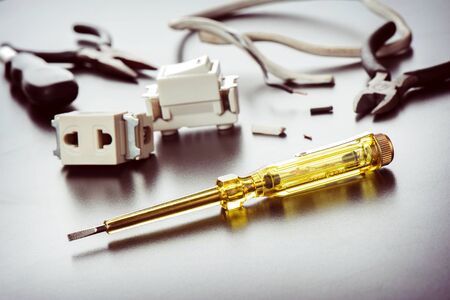 electrical tester screwdriver on technician desktop