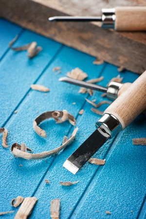 closeup chisels for wood on blue backgroundの写真素材