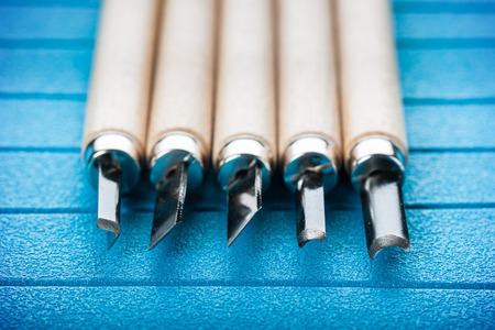 Set of new chisels isolated on blue backgroundの写真素材