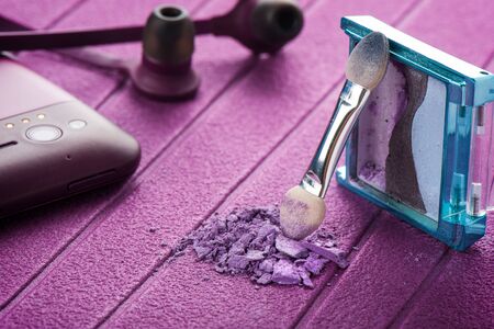 closeup purple cosmetics on purple background
