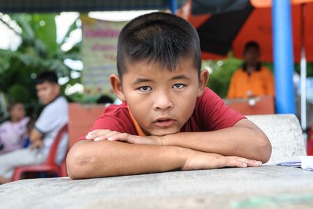 CHONBURI, THAILAND - AUGUST 23, 2014: Unidentified boy at Ban Kru Boonchoo. Ban Kru Boonchoo is the home for abandoned Down Syndrome kids.のeditorial素材