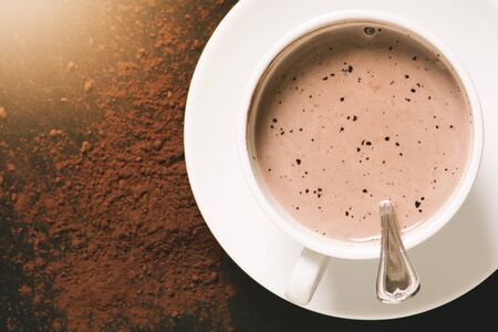 hot chocolate in white mug with cocoa powderの写真素材