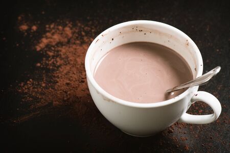 hot chocolate in white mug with cocoa powderの写真素材