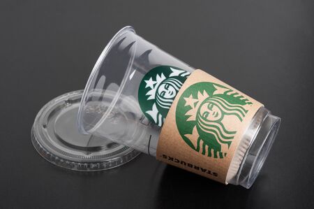 BANGKOK, THAILAND - FEBRUARY 08, 2015: Empty Starbucks coffee plastic cup on black background....