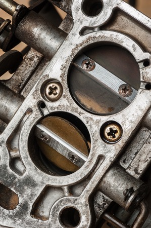 closeup details of old and dirty carburetorの写真素材
