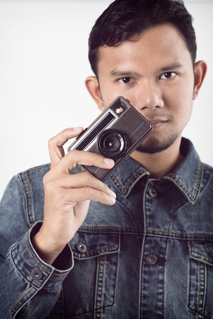 old vintage camera in hand