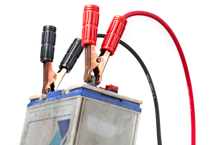 car battery with jumper cable isolated on white backgroundの写真素材