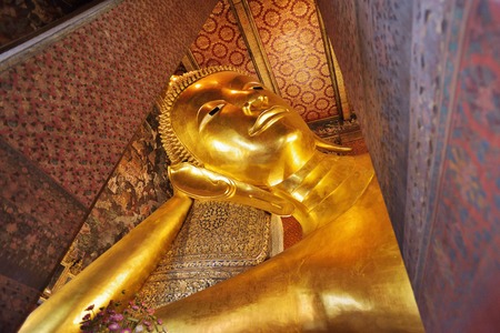 BANGKOK, THAILAND - FEBRUARY 19, 2015: Golden reclining buddha statue at Wat Pho (Wat Phra Chettuphon Wimon Mangkhlaram Ratchaworamahawihan) in Bangkok, Thailand.のeditorial素材