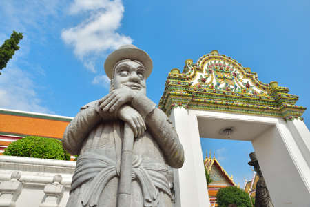 BANGKOK, THAILAND - FEBRUARY 19, 2015: Statue of chinese man at Wat Pho in Bangkok, Thailand.のeditorial素材