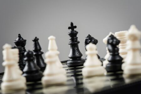 closeup old mini chess on chessboardの写真素材