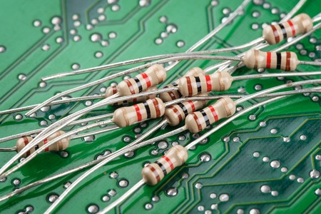 closeup heap of 1K or 1000 Ohms resistors on circuit board.の写真素材