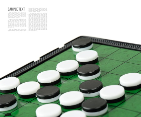closeup discs on green Reversi board (Othello)の写真素材