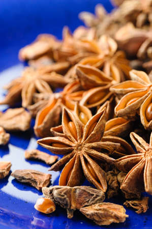 closeup details of star anise on blue plateの写真素材