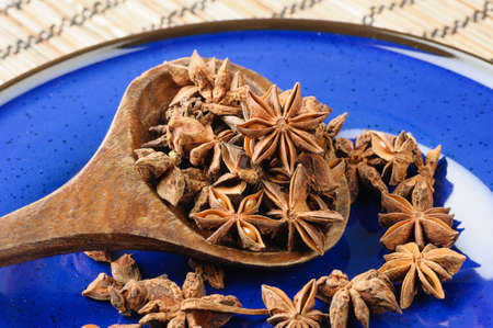 closeup details of star anise on blue plateの写真素材