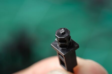 closeup section of plastic part after cut from toy sprue