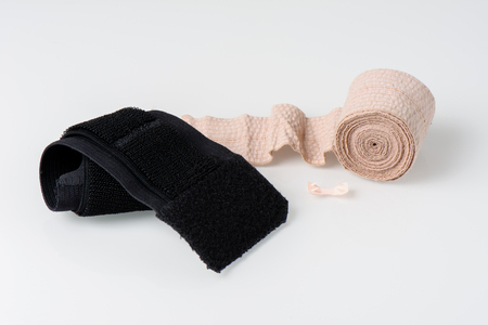 bandage and wrist support isolated on white backgroundの写真素材