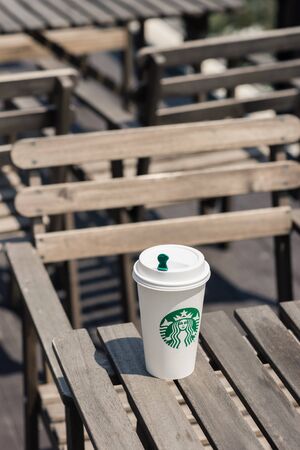 BANGKOK, THAILAND - APRIL 02, 2015: White paper cup with Starbucks logo. Starbucks is the world's largest coffee house with over 20,000 stores in 61 countries.のeditorial素材