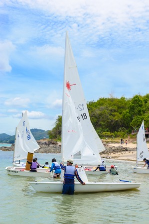CHONBURI, THAILAND - JULY 07, 2013: Unidentified tourists travel in the sea with sailboats.のeditorial素材