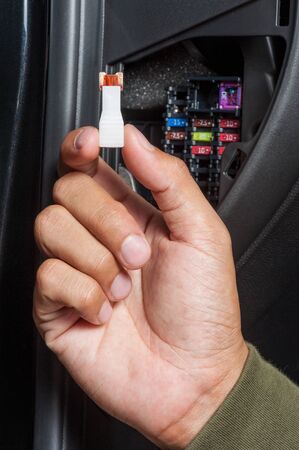 replacing the fuse in fuse box of the carの写真素材