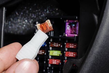 replacing the fuse in fuse box of the carの写真素材