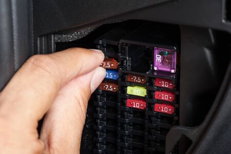 replacing the fuse in fuse box of the carの写真素材