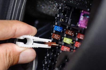 replacing the fuse in fuse box of the carの写真素材
