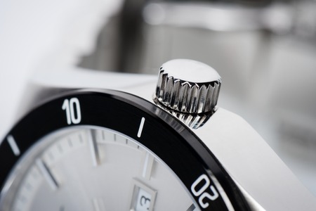 closeup shiny crown of men watchの写真素材