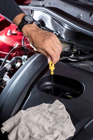 car maintenance, check the engine oil levelの写真素材