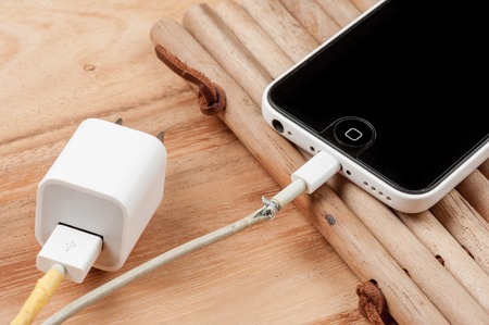 BANGKOK, THAILAND - SEPTEMBER 23, 2015: The broken iPhone charger cable.