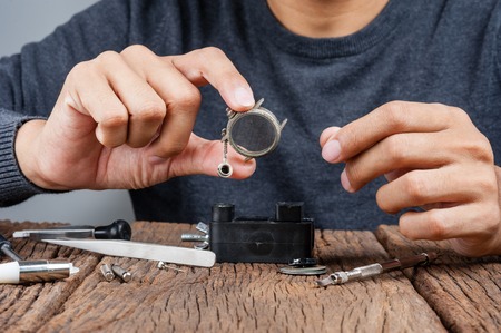 The man repairing the old watchの写真素材