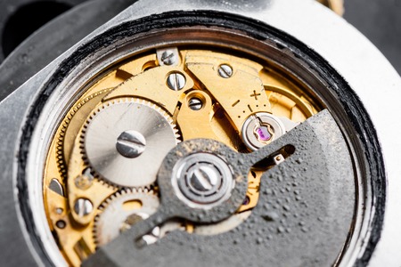 closeup the movement of old swiss made automatic watch