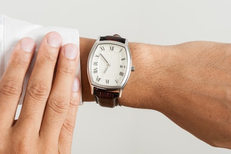 closeup vintage style of luxury men watch on businessman's wristの写真素材