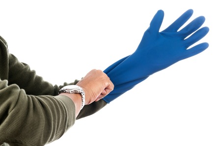 The man wearing blue rubber glove to protect his hand