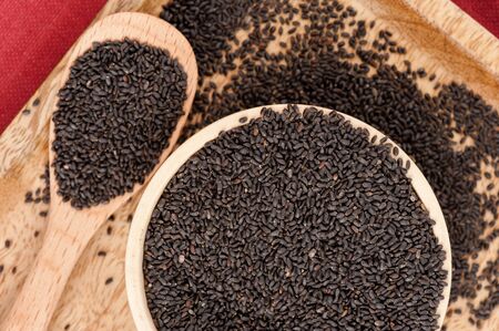 closeup sweet basil seeds in the bowlの写真素材