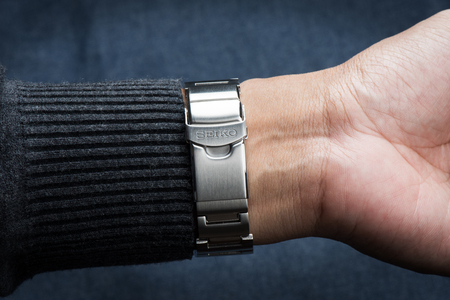 BANGKOK, THAILAND - NOVEMBER 04, 2015: The logo of brand SEIKO on metal watchband. SEIKO is a Japanese company that manufactures and sells watches, clocks, electronic devices, etc.のeditorial素材