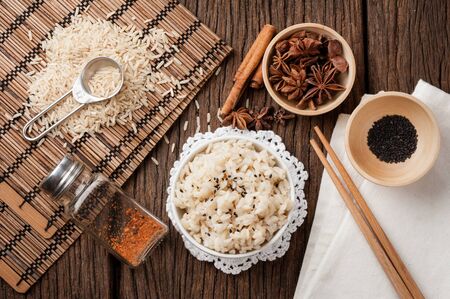 cooked brown rice in white bowlの写真素材