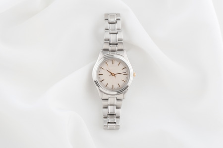 closeup classic woman wristwatch with stainless steel bracelet