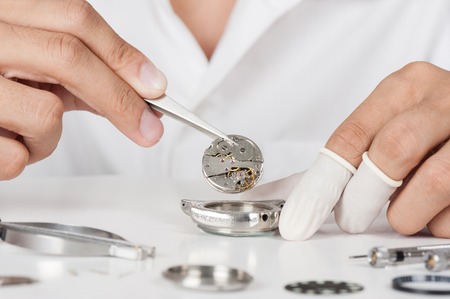 watchmaker repairing the automatic wristwatchの写真素材