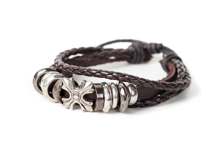closeup men's leather bracelet on white backgroundの写真素材