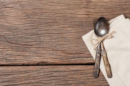 dinning table with old brass spoon and fork