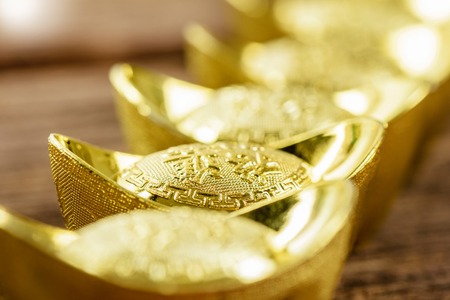 chinese gold ingot or chinese gold nugget with the chinese text on the top mean get your money...