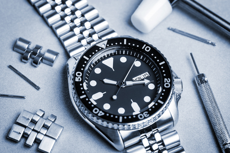 closeup men dive watch with stainless steel braceletの写真素材